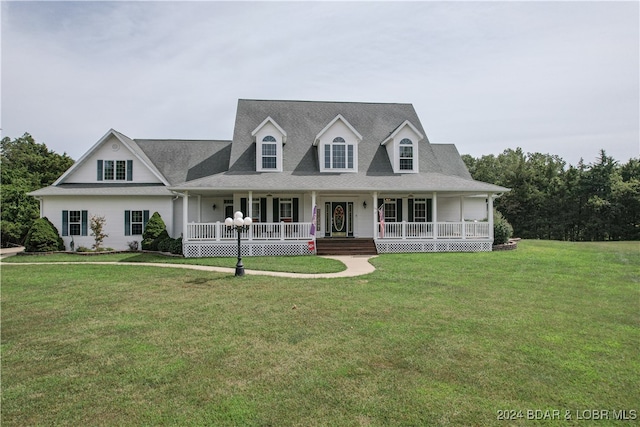 view of front of home with a porch and a front yard