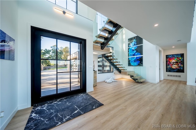 doorway to outside with hardwood / wood-style floors