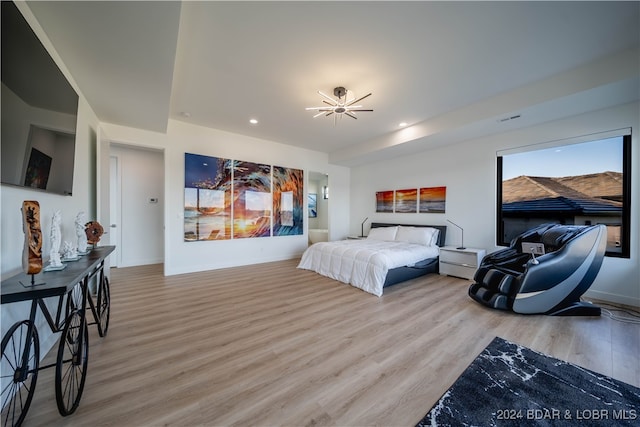 bedroom with hardwood / wood-style floors