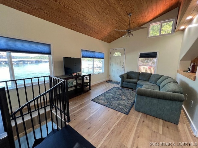 living room featuring hardwood / wood-style flooring, ceiling fan, high vaulted ceiling, and wood ceiling