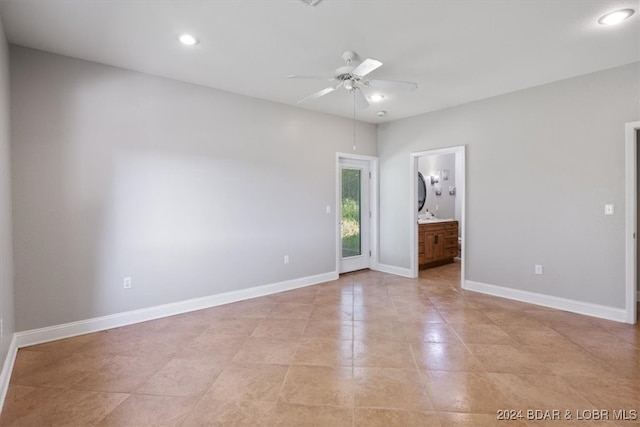 unfurnished bedroom featuring connected bathroom and ceiling fan