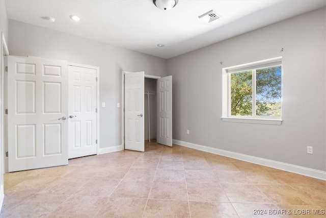 unfurnished bedroom featuring light tile patterned floors