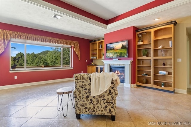 living area featuring a textured ceiling, a premium fireplace, and light tile patterned flooring