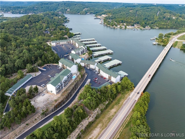 birds eye view of property with a water view