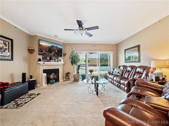 living room with crown molding, carpet floors, and ceiling fan