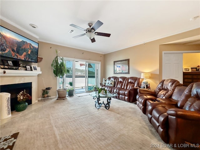 living room featuring ornamental molding and ceiling fan