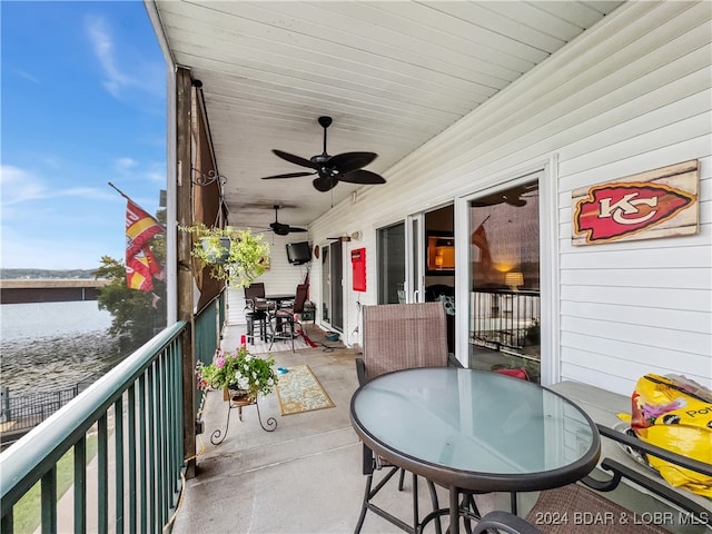 exterior space featuring a water view and ceiling fan