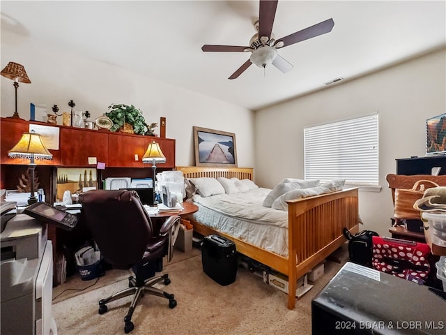 carpeted bedroom with ceiling fan