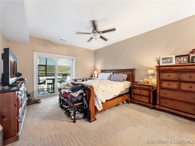 carpeted bedroom featuring access to outside and ceiling fan