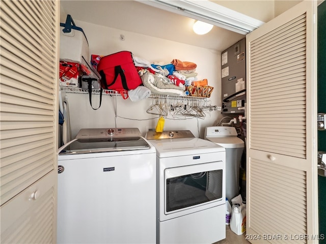 laundry room featuring washing machine and clothes dryer