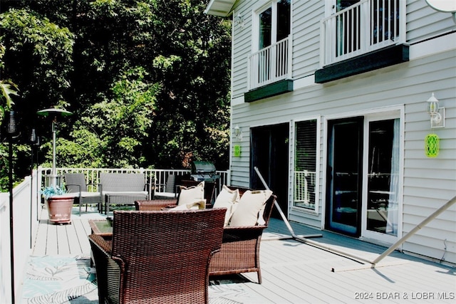 wooden terrace featuring area for grilling