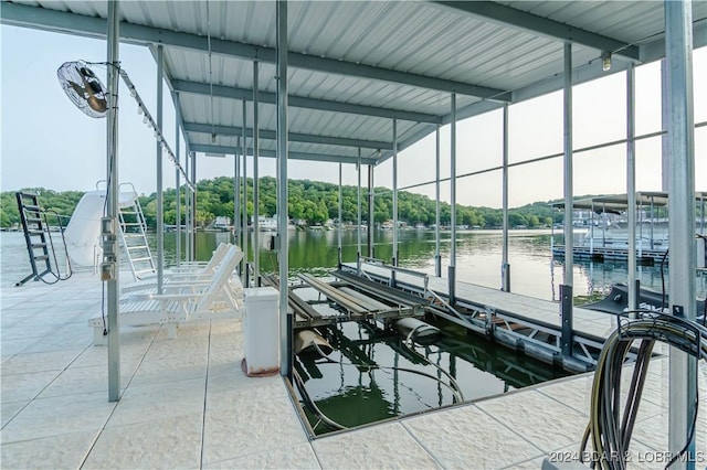 view of dock featuring a water view and boat lift