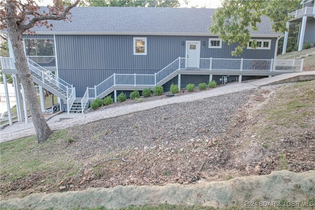 view of front of property featuring a wooden deck