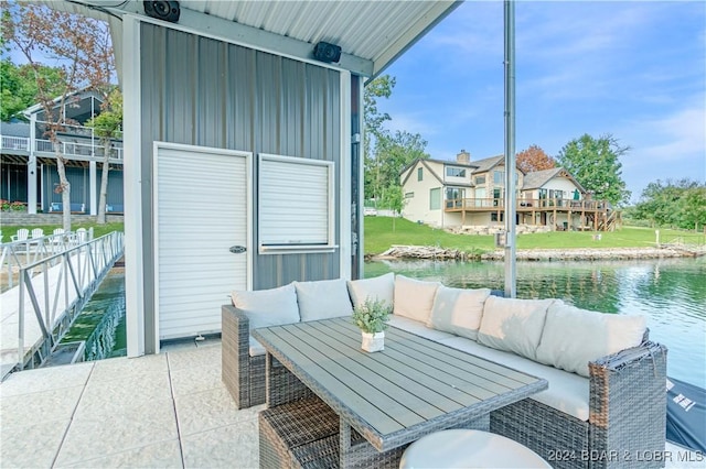 view of patio / terrace with a water view and an outdoor hangout area