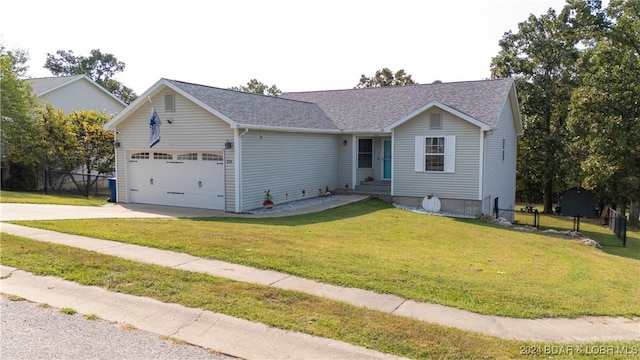 view of front of home featuring a garage and a front lawn