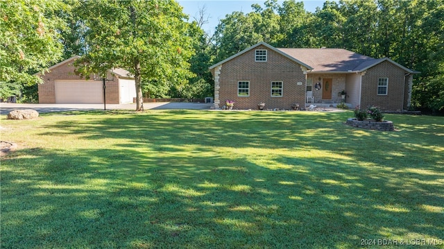 view of front facade with a front lawn and a garage