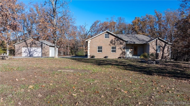 view of property exterior with a garage and a lawn