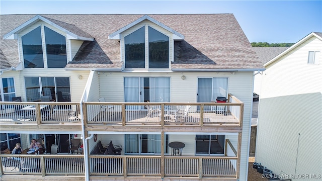 back of house with a balcony