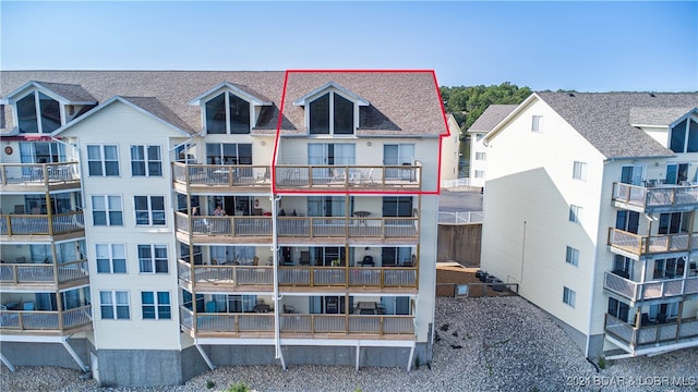 rear view of house featuring a balcony