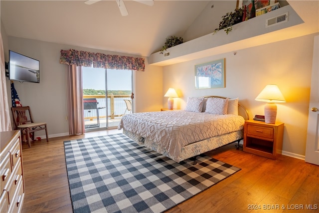 bedroom featuring light wood-type flooring, high vaulted ceiling, access to outside, and ceiling fan