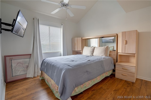 bedroom featuring lofted ceiling, ceiling fan, and hardwood / wood-style flooring