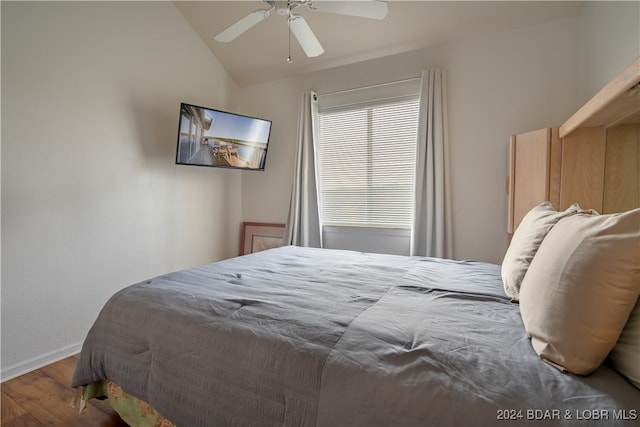 bedroom featuring vaulted ceiling, hardwood / wood-style flooring, and ceiling fan