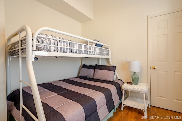 bedroom with hardwood / wood-style flooring