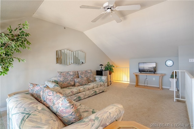 living room with vaulted ceiling, ceiling fan, and carpet