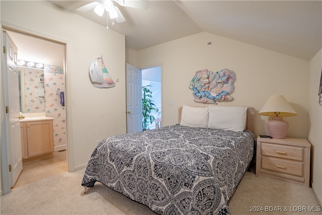 carpeted bedroom with vaulted ceiling, ensuite bathroom, and ceiling fan