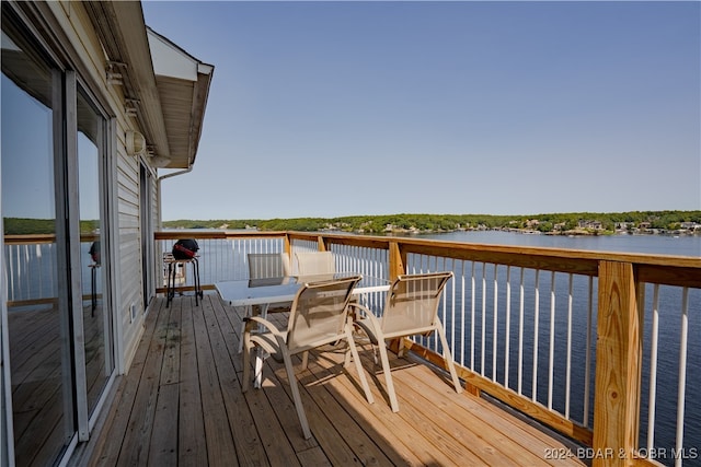 wooden terrace with a water view