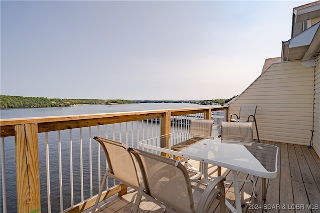 wooden deck with a water view