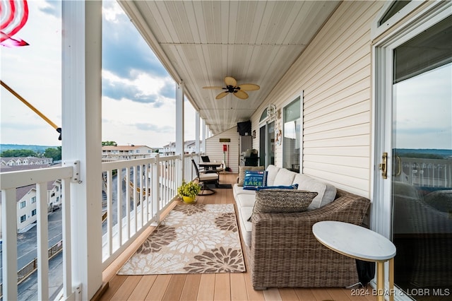 exterior space with an outdoor living space and ceiling fan