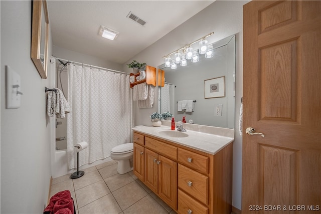 full bathroom with vanity, toilet, shower / tub combo with curtain, and tile patterned floors