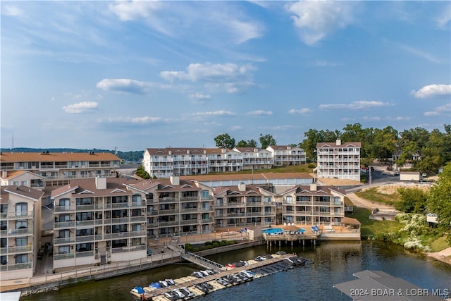 birds eye view of property with a water view