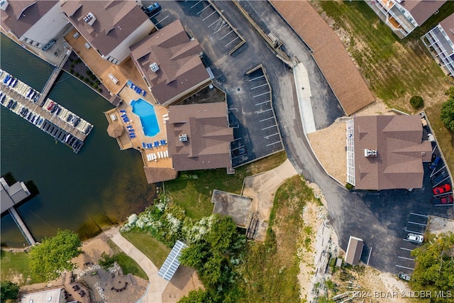 birds eye view of property with a water view