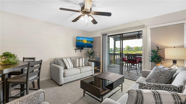 living room with ceiling fan and light colored carpet