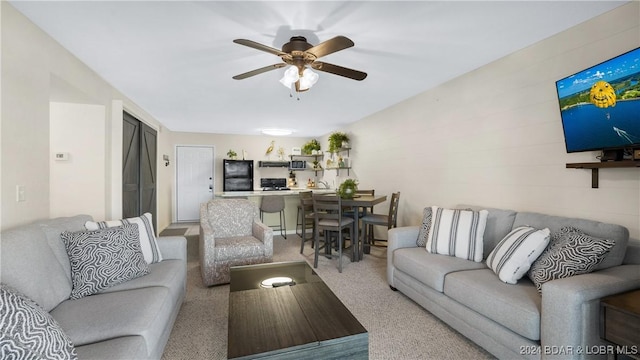 living room with ceiling fan