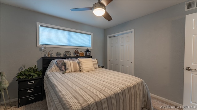 bedroom featuring carpet floors, a closet, and ceiling fan