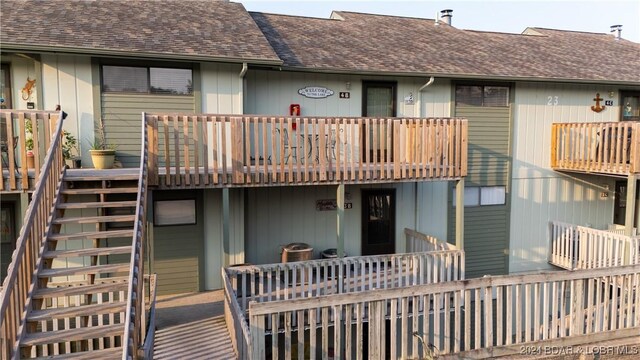 back of property featuring a balcony