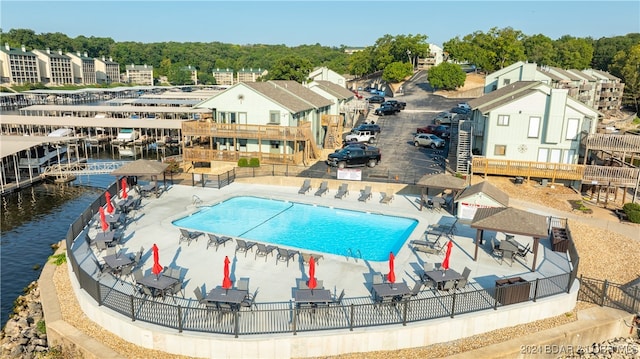 view of swimming pool featuring a water view