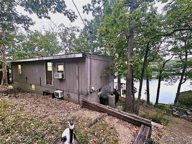 view of side of property with cooling unit