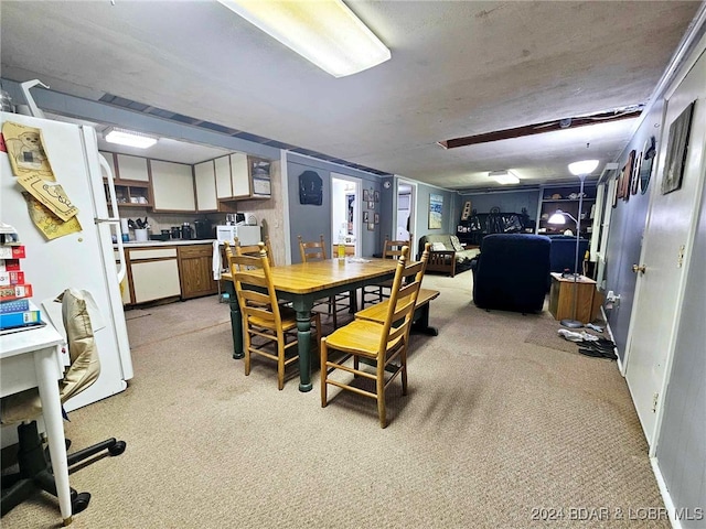 dining space with light carpet