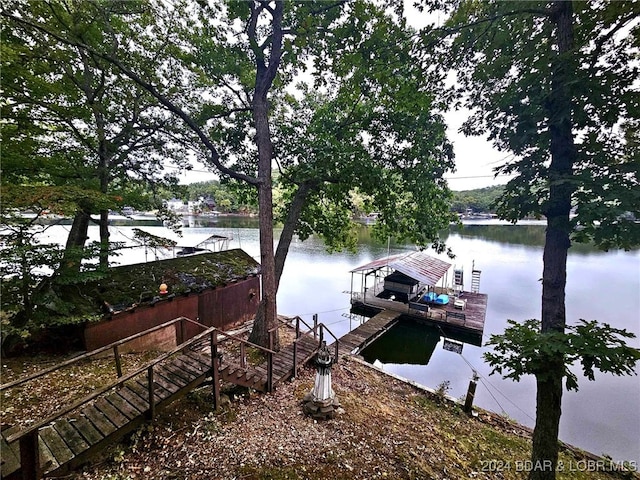 dock area with a water view