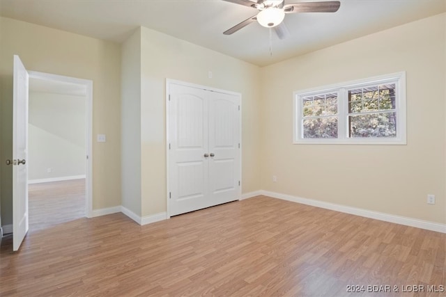 unfurnished bedroom with a closet, ceiling fan, and light hardwood / wood-style flooring