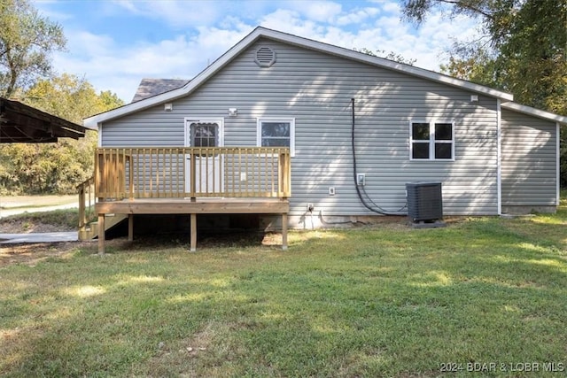 back of house featuring a yard, central air condition unit, and a deck