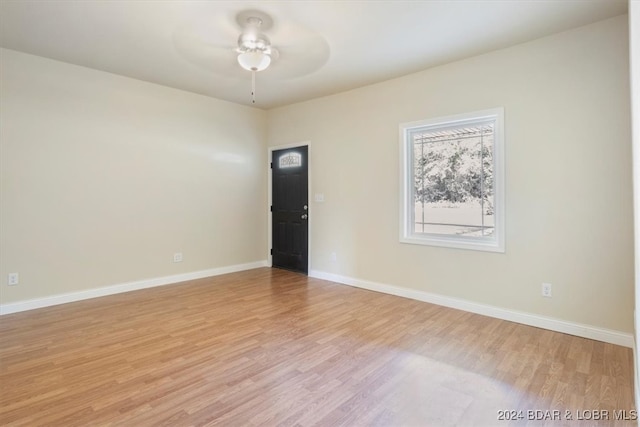 spare room with ceiling fan and light hardwood / wood-style flooring