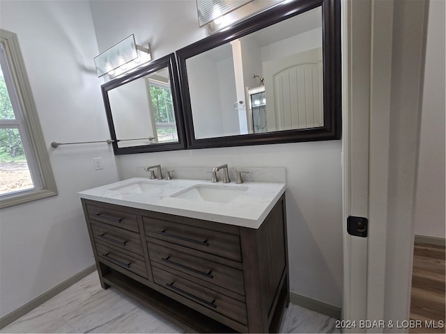 bathroom featuring hardwood / wood-style floors and vanity