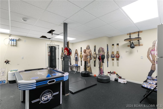 exercise room featuring a drop ceiling