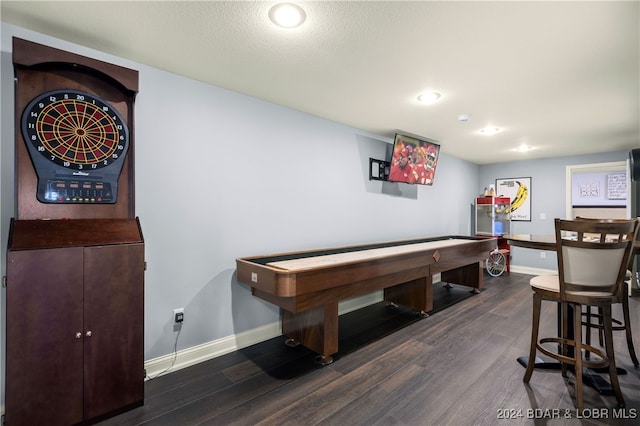 rec room with a textured ceiling and dark hardwood / wood-style flooring