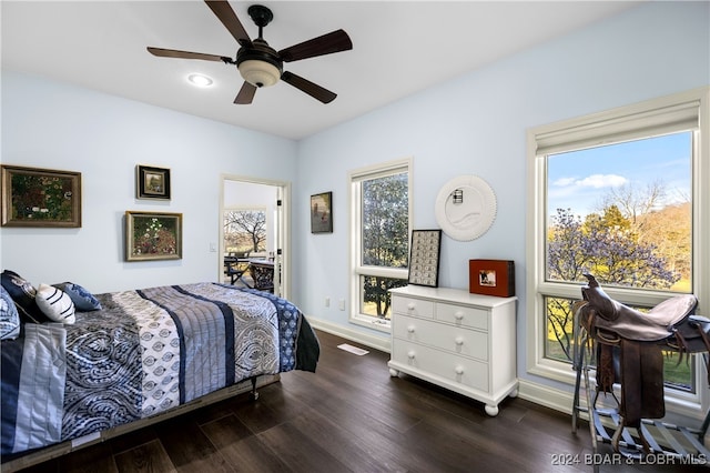 bedroom with ceiling fan and dark hardwood / wood-style floors